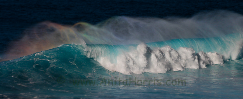Rainbow in a wave at Peahi Jaws,
